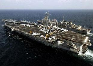 The USS Harry S. Truman aircraft carrier and the USNS Arctic sailing side-by-side in the Gulf. (Xinhua/AFP File Photo)