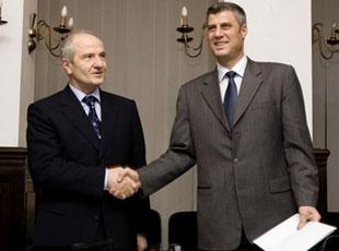 Kosovo's President and leader of the Democratic League of Kosovo (LDK), Fatmir Sejdiu, left, shakes hands with Hashim Thaci, right, leader of the PDK, in Kosovo's capital Pristina, Monday, Jan. 7, 2008. (AP Photo/Visar Kryeziu) 