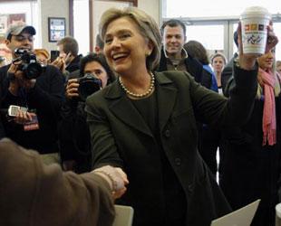 Democratic presidential candidate U.S. Senator Hillary Clinton (D-NY) holds up a cup of vanilla chai (tea) as she arrives in Concord, New Hampshire Jan. 8, 2008, the day of the New Hampshire Primary. With more than 60 percent of precincts counted, Clinton led Obama by only 3 percentage points, 39 to 36, as the New Hampshire presidential primary result was rolling out on Tuesday. (Xinhua/Reuters Photo)