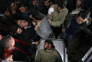 The body of a Palestinian killed by Israeli fire is delivered to the morgue at the al-Shifa hospital in Gaza City Jan. 15, 2008.  (Xinhua Photo)