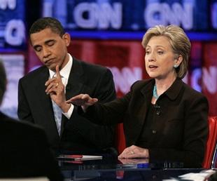 Sen. Barack Obama, D-Ill., left, gestures for time as Sen. Hillary Rodham Clinton, D-N.Y., responds to a question during a Democratic presidential debate in Los Angeles, Thursday, Jan. 31, 2008. [Agencies] 