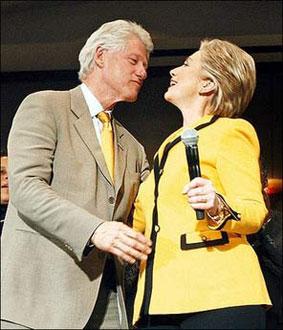 Former U.S. president Bill Clinton kisses his wife, New York Senator and Democratic presidential hopeful Hillary Rodham Clinton during a rally Jan. 25, 2008. (Xinhua/AFPPhoto)