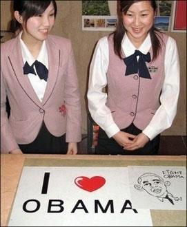 Receptionists at the Sekumiya Hotel in the city of Obama in Fukui prefecture show off a sign they put up wishing good luck to US presidential candidate Barack Obama at the hotel front, on February 10, 2008. [Agencies]