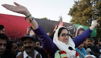 Former Pakistani Prime Minister Benazir Bhutto waves to her supporters at Liaquat Bagh in Rawalpindi, Pakistan, Dec. 27, 2007. Bhutto died Thursday as Party security adviser says she was shot in the neck and chest as she got into her vehicle, then gunman blew himself up. At least 20 others were also killed in a blast that took place as Bhutto left the rally. (Xinhua/AFP Photo)