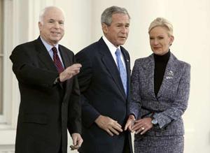 U.S. President George W. Bush welcomes Republican Presidential hopeful Sen. John McCain (L) and his wife Cindy to the White House in Washington March 5, 2008. McCain scored victories in Texas, Ohio, Vermont and Rhode Island on Tuesday to complete his improbable comeback from the political graveyard last summer to become his party's standard-bearer. (Xinhua/Reuters Photo)