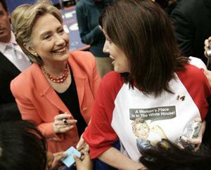 Democratic presidential candidate Hillary Rodham Clinton (L) speaks with a supporter at a town hall meeting in Indianapolis March 29, 2008. (Xinhua/Reuters Photo)