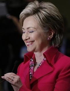Democratic presidential hopeful, Sen. Hillary Rodham Clinton, D-N.Y., smiles after playing an April Fool's Day joke on reporters, stating that she is willing to challenge fellow Democratic presidential hopeful Sen. Barack Obama, D-Ill., to a game of bowling, Tuesday, April 1, 2008, at the start of a news conference in Philadelphia. [Agencies]