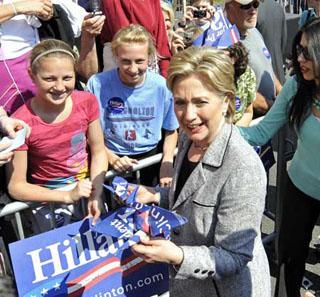 U.S. Democratic presidential candidate Senator Hillary Clinton (D-NY) accepts paper birds made of Hillary for President signs from supporters at a rally in West Chester, Pennsylvania April 19, 2008.  (Xinhua/Reuters Photo)
