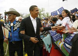 U.S. Democratic presidential candidate and US Senator Barack Obama, (D-IL), arrives with John and Mary Blackfeet, his new Crow "parents" who adopted him as a member of the Crow nation, for a campaign rally in Crow Agency, Montana May 19, 2008.(Xinhua/Reuters Photo)
