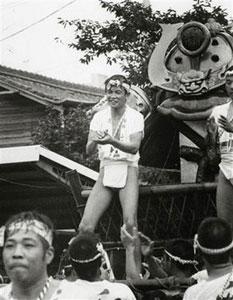 In this 1978 photo distributed by Taro Aso office in Tokyo, Taro Aso, then 40-year-old, wearing a traditional Japanese festival outfit, rides on a float during the annual Iizuka Yamagasa festival in his hometown of Iizuka, southwestern Japan. Japan's troubled ruling Liberal Democratic Party elected brash former Foreign Minister Aso as its new leader Monday, Sept. 22, 2008.[Agencies]