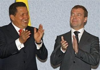 Russian President Dmitry Medvedev, right, and Venezuelan President Hugo Chavez applaud at a signing ceremony in Orenburg, about 1300 kilometers (800 miles) southeast of Moscow, on Friday, Sept. 26, 2008. Russian and Venezuelan officials on Friday signed agreements meant to bolster cooperation in the oil and gas industry, playing up energy ties between two nations trying to decrease U.S. influence around the world.(AP Photo/RIA-Novosti, Dmitry Astakhov, Presidential Press Service)