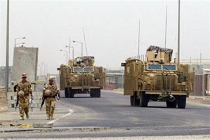 File photo shows British soliders on patrol around the airport of the southern city of Basra. British troops are no longer necessary for the security of Iraq and should go home, Prime Minister Nouri al-Maliki said in a newspaper interview published here Monday.(AFP/File/Ali Yussef)