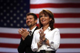 U.S. Republican vice presidential nominee Alaska Governor Sarah Palin and her husband Todd attend at a rally in Virginia Beach, Virginia Oct. 13, 2008.(Xinhua/Reuters Photo)