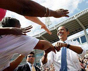 Democratic presidential nominee Barack Obama shakes hands with supporters during a campaign event at Legend's Field in Tampa, Florida.(AFP/Getty Images/Joe Raedle)