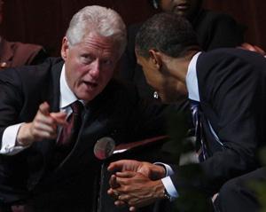 U.S. Democratic presidential candidate Senator Barack Obama(R) speaks with former President Bill Clinton at a memorial service for Rep. Stephanie Tubbs Jones (D-OH) in Cleveland, Ohio, August 30, 2008.(Xinhua/Reuters Photo)