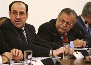 Iraqi Prime Minister Nouri al-Mailki, left, and President Jalal Talabani, right, are seen during a meeting in Baghdad, Iraq, Friday, Oct. 17, 2008.(AP Photo/Khalid Mohammed)