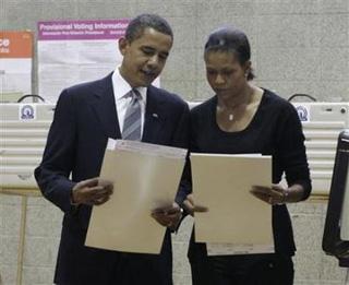 U.S. Democratic presidential nominee Senator Barack Obama (D-IL) and his wife Michelle prepare to cast their ballots in the U.S. presidential election at the Beulah Shoesmith Elementary School in Chicago, November 4, 2008.(Jason Reed/Reuters)