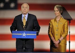 U.S. Republican presidential nominee Senator John McCain (R-AZ) speaks during his election night rally with his wife Cindy (R) and vice presidential nominee Sarah Palin in Phoenix November 4, 2008.REUTERS/Brian Snyder