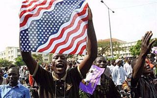 Kisumu residents wave a US flag as they take to the streets as they celebrate after the announcement of the victory of US presidential candidate Barack Obama in the US presidential election. Barack Obama's friends and relatives erupted into song and dance in the Kenyan family homestead of Kogelo Wednesday, urging the nation's new hero to change the world and remember Kenya in the process.(AFP/Simon Maina)