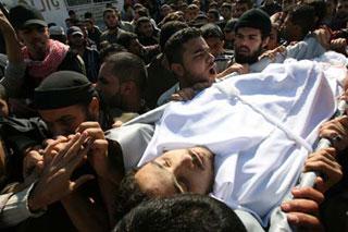 Palestinians carry the body of Ahmed al-Hellou, a militant of the Popular Resistance Committees (PRC), during a funeral in Gaza, on Nov. 16, 2008. An Israeli attack left four Palestinian militants dead in the eastern Gaza Strip on Sunday.(Xinhua Photo)
