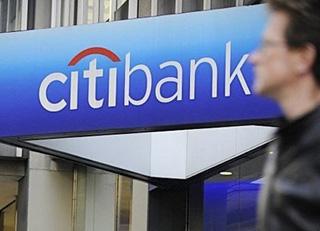 A man walks by a Citibank branch at the US bank Citigroup world headquarters on Park Avenue, in New York. Wall Street and European stock markets soared Monday as investors cheered a massive bailout for US banking giant Citigroup and the prospect of more government money to ease the pain of recession.(AFP/File/Emmanuel Dunand)