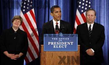 U.S. President-elect Barack Obama is flanked by Council of Economic Advisors Director-designate Christina Romer(L), National Economic Council Director-designate Lawrence Summers (R) as he announces the members of his economic policy team during a news conference in Chicago, November 24, 2008.(Xinhua/Reuters Photo)