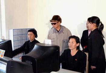 This undated photo released on Dec. 17, 2008 by the official Korean Central News Agency (KCNA) of the Democratic People's Republic of Korea (DPRK) shows Kim Jong Il (L, back), top leader of DPRK, inspects an electronics institute in Kanggye city of Jagang province of DPRK. Developing information technology (IT) should be the most important task for DPRK, the official Rodong Sinmun daily quoted Kim Jong Il as saying Wednesday.(Xinhua/KCNA)