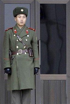 A North Korean soldier stands guard as Seoul Metropolis Mayor Oh Se-hoon visits the truce village of Panmunjom in the demilitarized zone separating the two Koreas, 55km (31 miles) north of Seoul, December 16, 2008.(Hong Chan-sun/Newsis/Reuters)