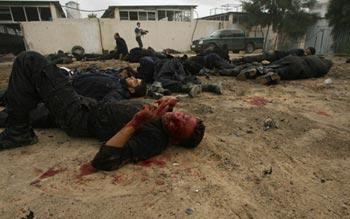 Bodies of Palestinian Hamas policemen are scattered on the ground following an Israeli air strike in Gaza City on December 27, 2008. About 200 Palestinians were killed and hundreds wounded in a series of simultaneous Israeli air strikes in Gaza Strip. (Xinhua/Stringer) 