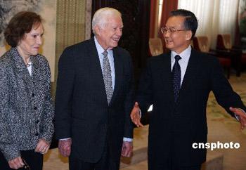 Visiting former US President Jimmy Carter, former US Secretary of State, Henry Kissinger, and former National Security Advisor, Zbigniew Brzezinski, have been received by Chinese Premier Wen Jiabao in Beijing.