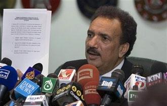 Pakistan's Interior Ministry Chief Rehman Malik shows a document to media during a press conference in Islamabad, Pakistan on Saturday, Jan. 17, 2009.(AP Photo/Anjum Naveed)