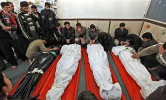 The bodies of four Hamas fighters from the same family - Bassem, Nashad, Sharif, and Rizek Suboh, lie in a mosque as family and friends come to pray over the bodies, which were dug out from rubble in Beit Lahiya, in the northern Gaza strip, Monday, Jan. 19, 2009. Israel hopes to pull all its troops out of the Gaza Strip by the time U.S. President-elect Barack Obama is inaugurated as president of the United States on Tuesday, Israeli officials said.(AP Photo/Ben Curtis)