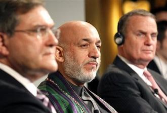 In this photo provided by the Munich Security Conference MSC, German Defense Minister Franz Josef Jung, Afghanistan's President Hamid Karzai and U.S. National Security Advisor James Jones, from left, are seen during the International Conference on Security Policy, at a hotel in Munich, southern Germany, on Sunday, Feb. 8, 2009. (AP Photo/Munich Security Conference MSC, Sebastian Zwez)