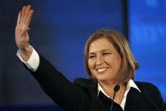 Israel's Foreign Minister Tzipi Livni waves to supporters upon her arrival at party headquarters in Tel Aviv, February 11, 2009. (Damir Sagolj/Reuters)