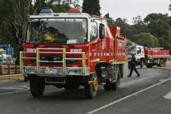 Fire trucks leave the town of Kinglake, 46km (29 miles) north of Melbourne, February 11, 2009. Cooler weather helped thousands of firefighters begin to get a grip on Australia's deadliest bushfires on Wednesday but 181 people were confirmed dead in parts of the southeast devastated by the infernos.REUTERS/Daniel Munoz