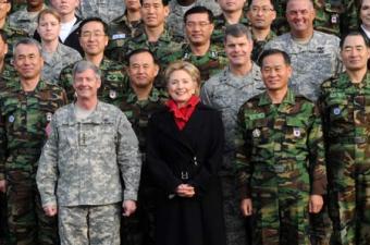 U.S. Secretary of State Hillary Clinton (C, 1st row) poses for photos with Gen. Walter Sharp (1st L, 1st row), the commander of U.S. Forces Korea, and officers during her visit at Yongsan Garrison in Seoul, on Feb. 20, 2009.(Xinhua Photo)