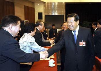 Jia Qinglin (front R), member of the Standing Committee of the Political Bureau of the Communist Party of China (CPC) Central Committee and also chairman of the National Committee of the Chinese People's Political Consultative Conference (CPPCC), meets with members of the 11th National Committee of the CPPCC from the Communist Youth League of China, the All-China Youth Federation, the All-China Federation of Trade Unions and All-China Women's Federation, in Beijing, capital of China, March 7, 2009. (Xinhua/Li Tao)