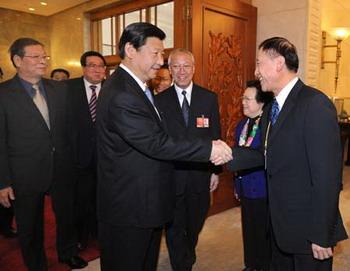Chinese Vice President Xi Jinping (front L), who is also a member of the Standing Committee of the Political Bureau of the Communist Party of China (CPC) Central Committee, attends the panel discussion of deputies to the Second Session of the 11th National People's Congress (NPC) from south China's Hong Kong Special Administrative Region, in Beijing, capital of China, March 7, 2009. (Xinhua/Liu Jiansheng)