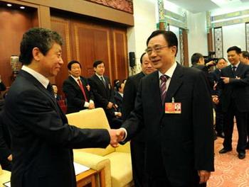 He Guoqiang (front R), member of the Standing Committee of the Political Bureau of the Communist Party of China (CPC) Central Committee, attends the panel discussion of deputies to the Second Session of the 11th National People's Congress (NPC) from north China's Hebei Province, in Beijing, capital of China, March 7, 2009. (Xinhua/Rao Aimin)