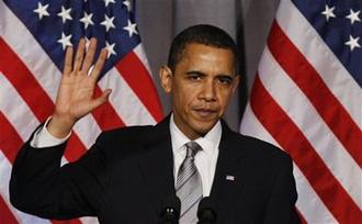 President Barack Obama finishes his speech at a Democratic National Committee fundraiser at the National Women in the Arts Museum in Washington, Wednesday, March 25, 2009.(AP Photo/Charles Dharapak)