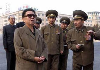 DPRK's leader Kim Jong-il (L) visits the Pyongyang Grand Theater, which was renovated, in this undated picture released by the KCNA early April 5, 2009.REUTERS/KCNA