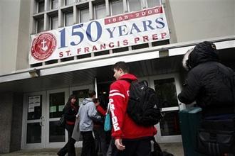 Students return to class at St. Francis Prep high school Monday, May 4, 2009 in the Queens borough of New York. St. Francis Prep was closed last week after the school was linked to an outbreak of swine flu.(AP Photo/Jason DeCrow)